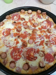 A picture of Choma sausage pizza.