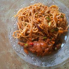 A picture of Spaghetti and chicken.