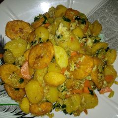 A picture of Fried plantain and potato with egg.
