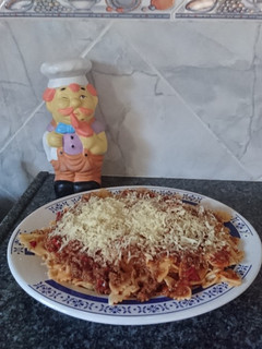 Una foto de Fideos con tuco 🍝
