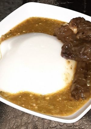 A picture of Tuwon masara with okro soup.