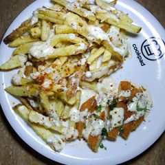 A picture of Cheesy Chicken fries with yogurt herb Sauce.