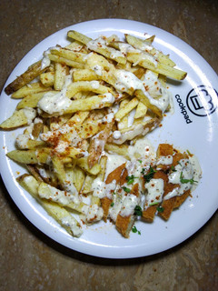 A picture of Cheesy Chicken fries with yogurt herb Sauce.