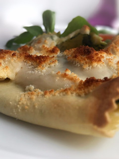 Una foto de Saquitos de lasaña rellenos de espinacas, almendras y piñones