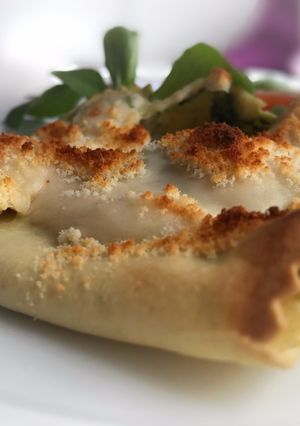 Una foto de Saquitos de lasaña rellenos de espinacas, almendras y piñones