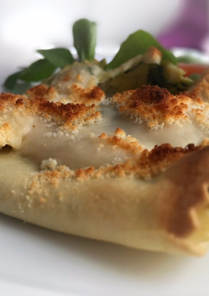 Una foto de Saquitos de lasaña rellenos de espinacas, almendras y piñones