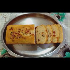 A picture of Eggless Tutti Frutti bread cake.