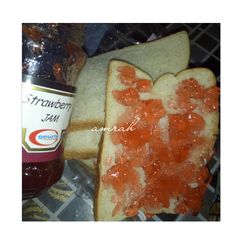 A picture of Sliced bread with jam.