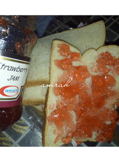 A picture of Sliced bread with jam.