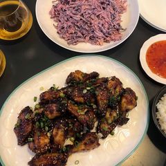 A picture of Sweet & sticky wings with classic slaw.