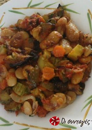 A picture of Baked Giant Beans with Herbs and Vegetables.