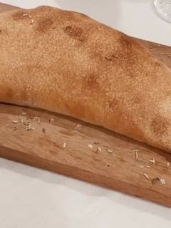 Foto de Pizza Calzone de Cogumelos e Bacon