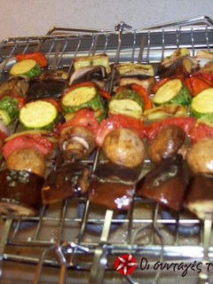 A picture of Grilled Vegetable Skewers with Sauce.