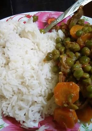 A picture of Beef stew and rice.