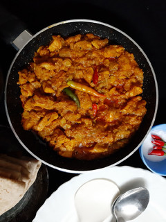 A picture of Jhinge Chicken Posto (Chicken with Ridge gourd and poppy seeds).