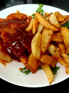 A picture of My Tasty Chicken, Onion in BBQ Sauce with Homemade Chips 🤩.