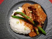 A picture of beef short ribs in red wine
