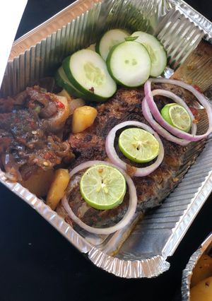 A picture of Grilled fish with potato sauce.