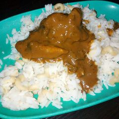 A picture of Rice and macaroni with banga soup.