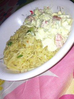 A picture of Avocado salad and noodles.