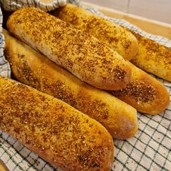 A picture of Cheese & oregano baguettes.