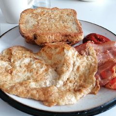A picture of Eggy bread and bacon fried omelette.