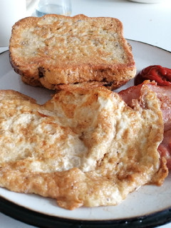 A picture of Eggy bread and bacon fried omelette.