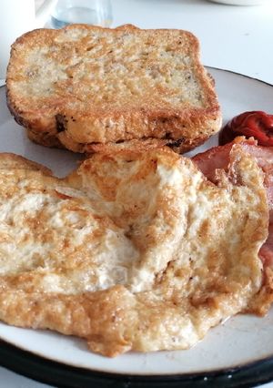 A picture of Eggy bread and bacon fried omelette.