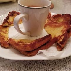 A picture of French toast bread with tea.