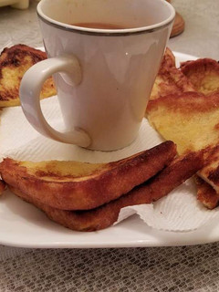 A picture of French toast bread with tea.