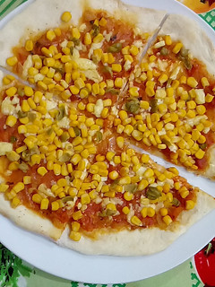 Una foto de Pizza de masa casera