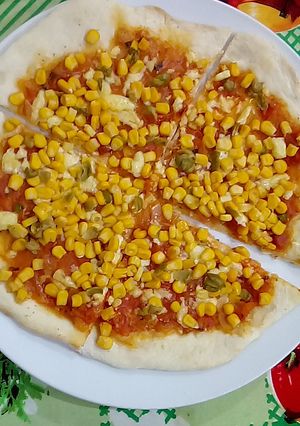 Una foto de Pizza de masa casera