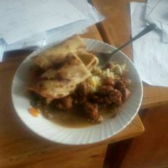 A picture of Beef stewed served with chapati.