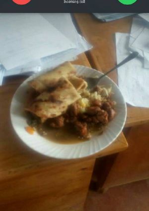 A picture of Beef stewed served with chapati.