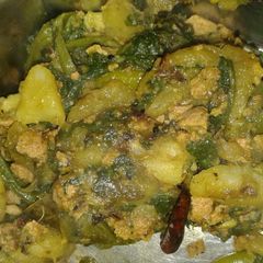 A picture of Palak and veggies stir fry.