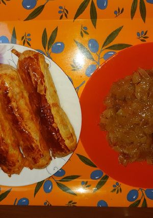 A picture of Puff pastry hot dogs with caramelized onions.