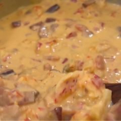 A picture of Homemade Queso with crawfish and andouille sausage.