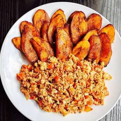 A picture of Scrambled eggs and Fried Plantain.