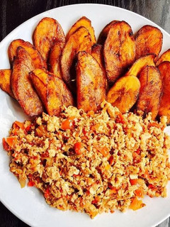 A picture of Scrambled eggs and Fried Plantain.