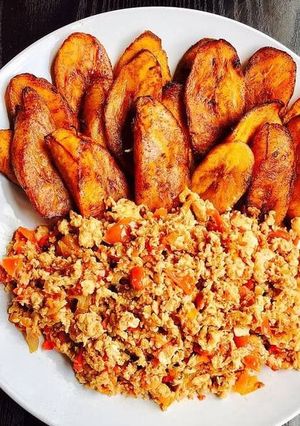 A picture of Scrambled eggs and Fried Plantain.