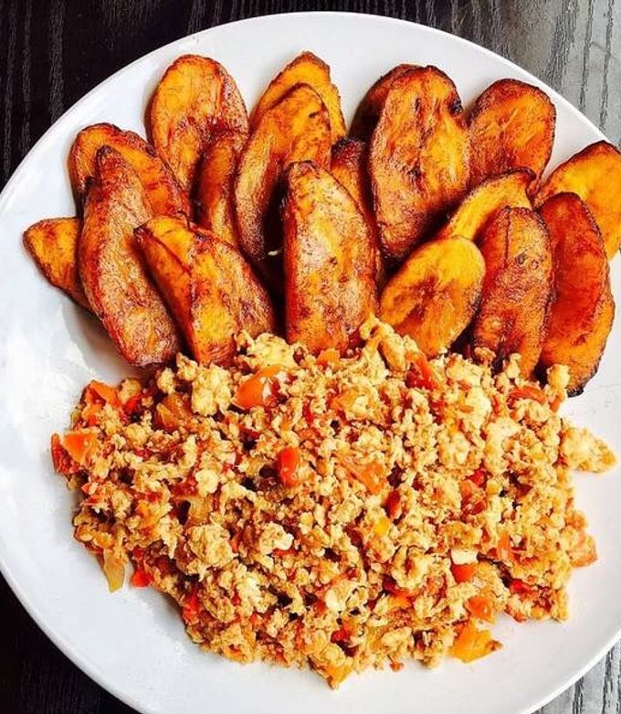 A picture of Scrambled eggs and Fried Plantain.