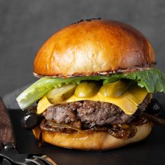 A picture of Wagyu Burgers with Onion Confit and Sautéed Mushroom.