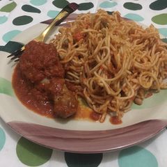 Daisy’s Christmas treats - Spaghetti jollof and stewed Chicken A picture of Daisy’s Christmas treats - Spaghetti jollof and stewed Chicken.