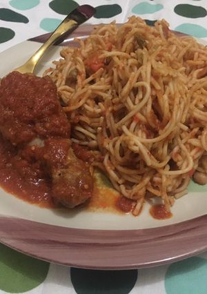 A picture of Daisy’s Christmas treats - Spaghetti jollof and stewed Chicken.