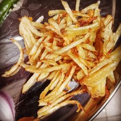 A picture of Bengali aloo bhaja potato fry.