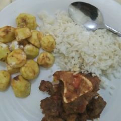 A picture of Stewed Beef, deep fried potatoes served with boiled rice.