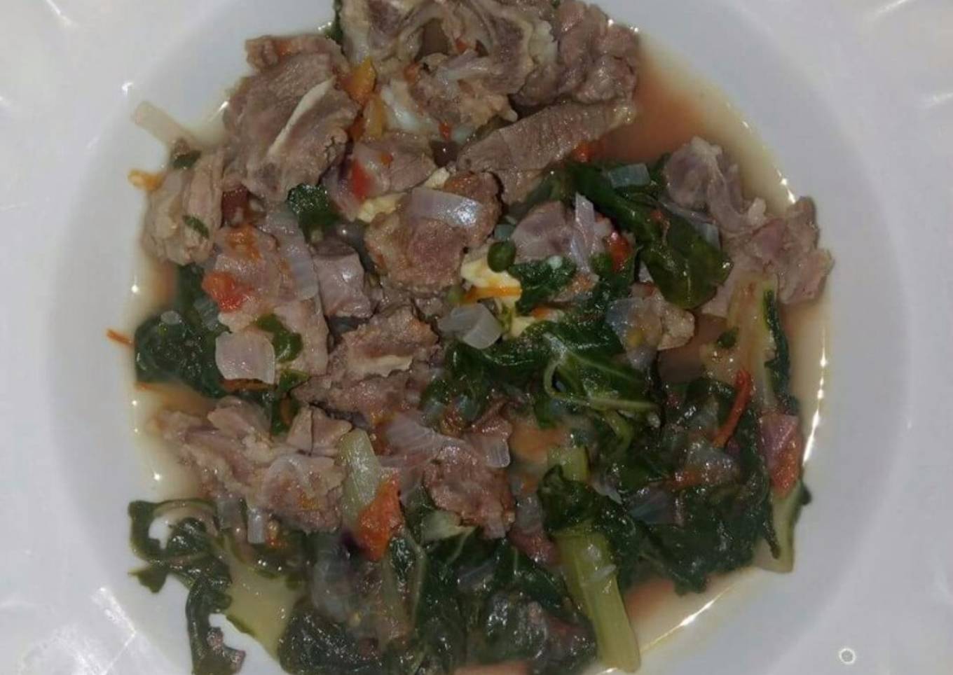 Boiled goat and spinach