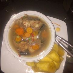 A picture of Fresh cat fish peppersoup with boiled plaintain.