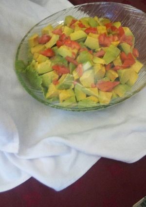 A picture of Tomato and avocado salad.