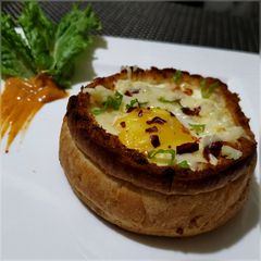 A picture of Cheesy Egg with Baked Bread Bowl.